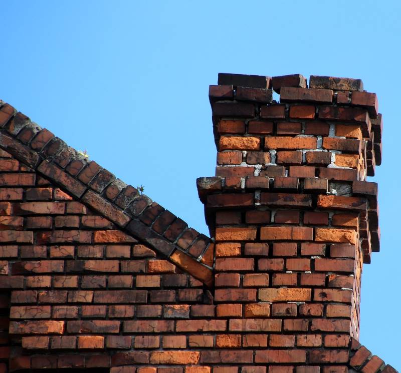 Signs Your Finksburg Home Needs a Chimney Inspection Damaged chimney on an Finksburg home showing cracks and missing mortar